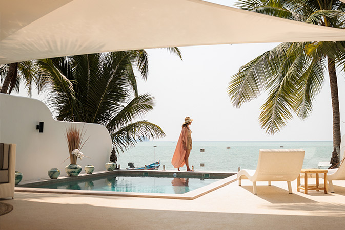 Standing by the pool at a resort.