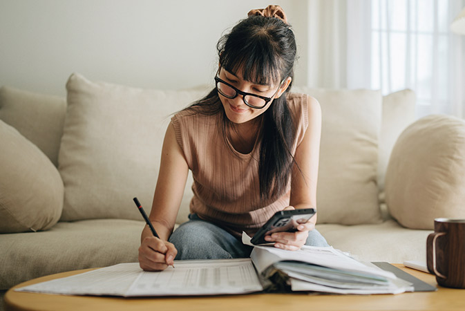 Person using a calculator doing finances.